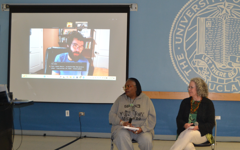 Image of Keris Jän Myrick and Lauren Clark with Reid Davenport.